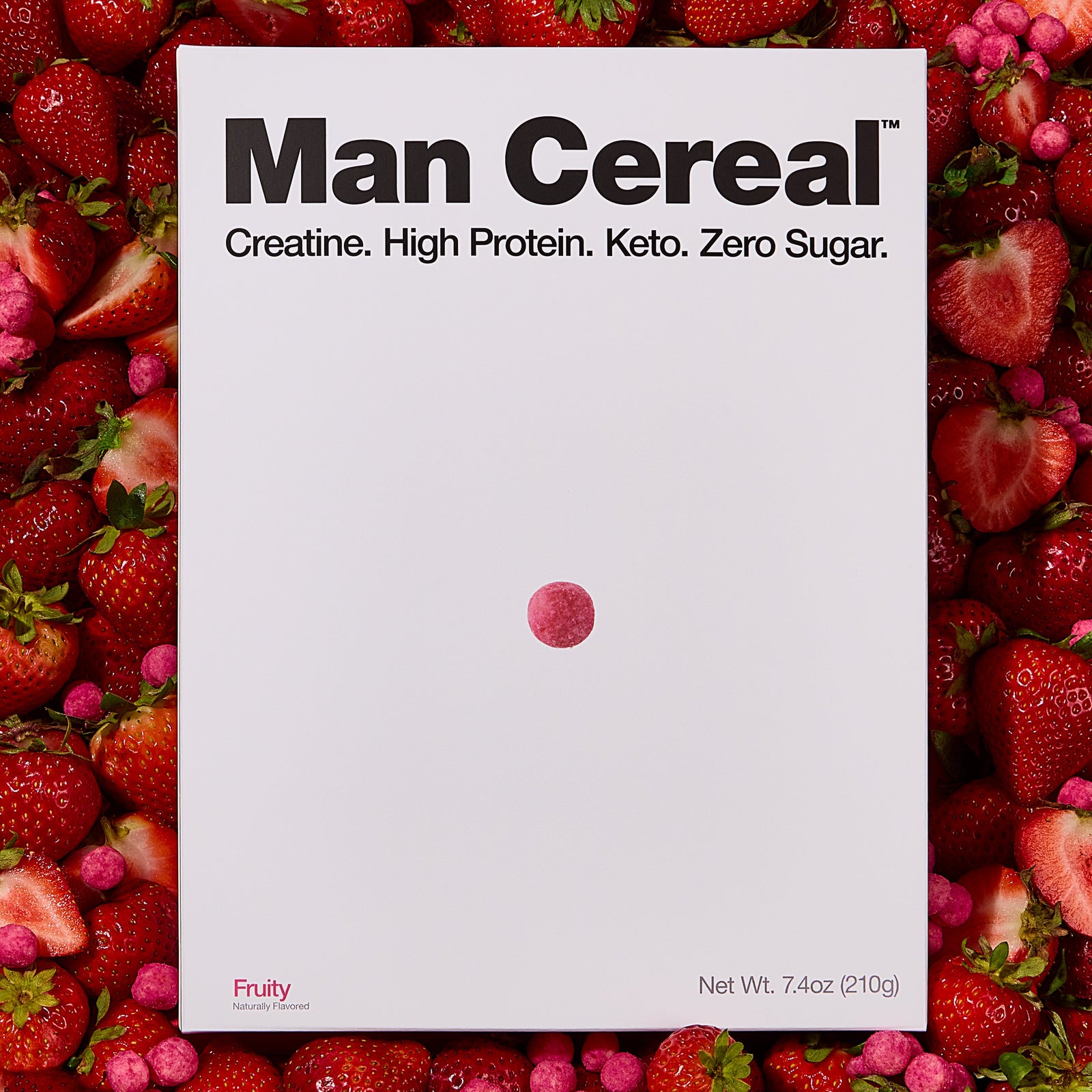 Man Cereal box surrounded by strawberries and raspberries